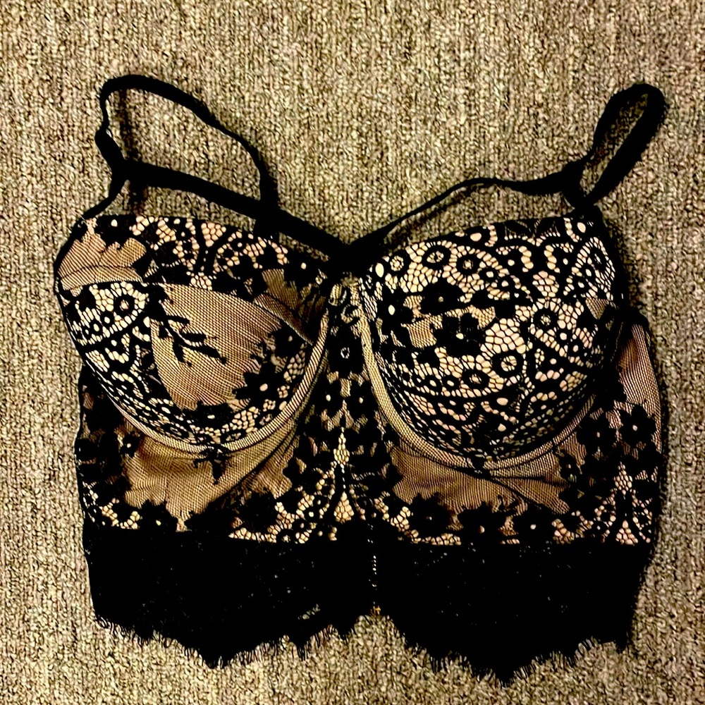 Size small preowned great condition black lace with nude underlay zip closure